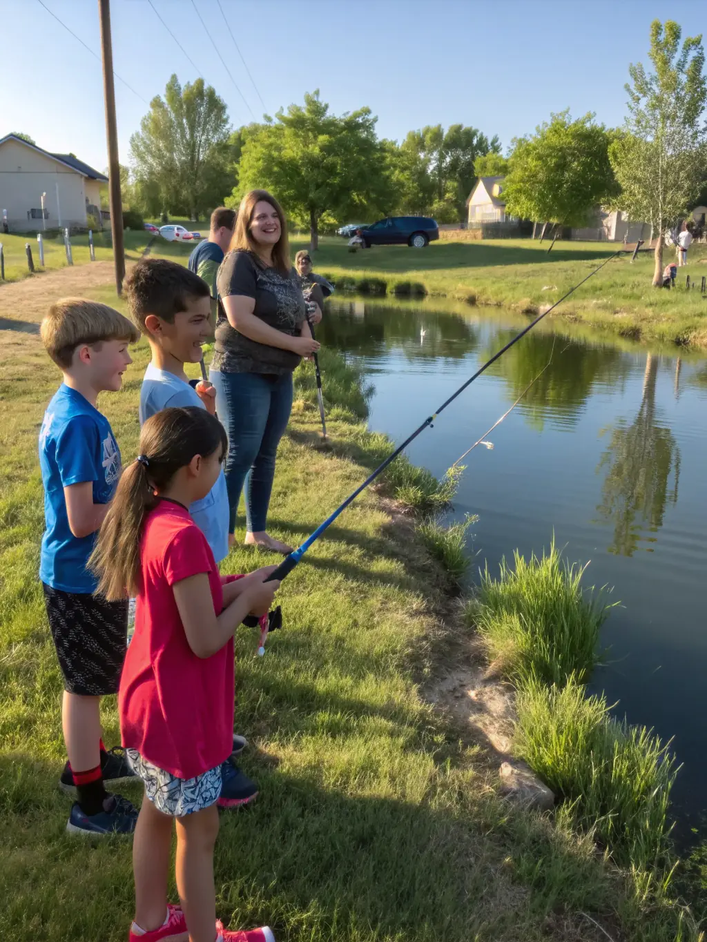 A group of children participating in a fishing workshop organized by FPPMA12, learning about responsible angling and aquatic conservation.